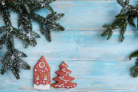 Christmas gingerbread on a white mitten. on a blue wooden background. New Year cardの写真素材