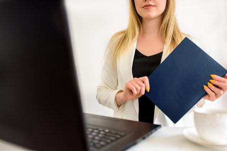 Female lawyer giving a consultation online at home. Young girl student at a laptop. Online...