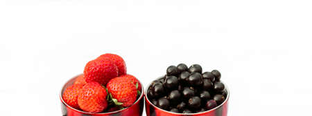 strawberries and black currants in a mug, concept summer in the villageの写真素材