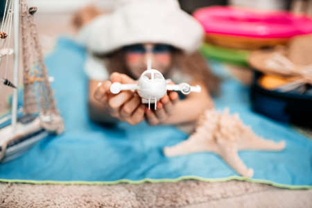 woman tuck at quarantine at home dreaming about sea beach vacation.の写真素材