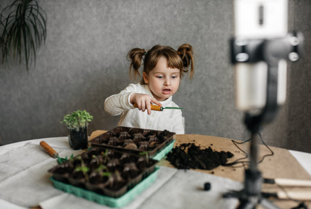 young girl blogger is broadcasting live gardening. Ecology and blogging concept