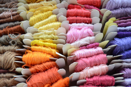 Skeins of colorful threads in a warm colors for embroidery and sewing