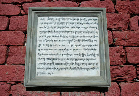 Buddhist prayers on the wall of the monastery close to Tyangboche villageの写真素材