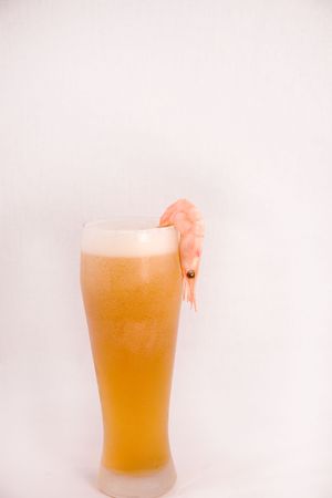 goblet with cool beer and prawnの写真素材