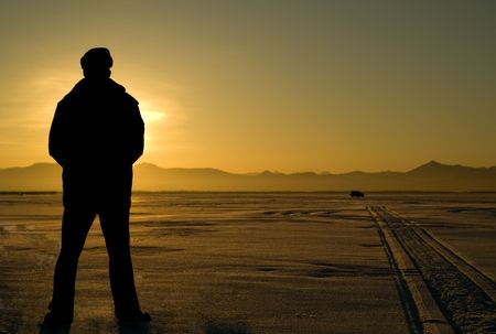 Silhouette menes on background in sunset.の写真素材