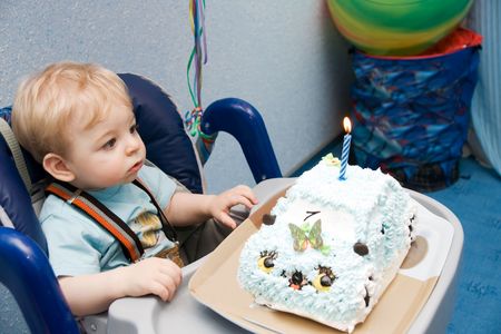 portrait of the tot with cake at birth dayの写真素材