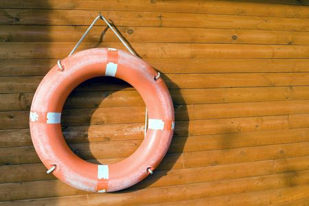 life buoy hang on wooden wallの写真素材