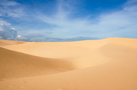 white dunes and blue sky in vietnamの写真素材