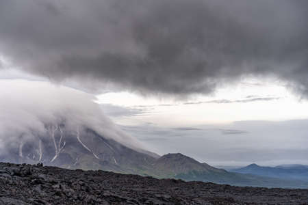 Active lava flow against the background of the Bolshaya Udina volcano - Kamchatka, Russia.の写真素材
