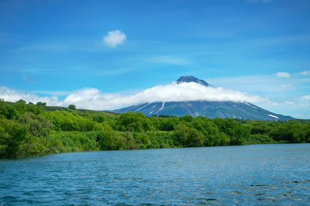 Russia, Kamchatka. South Kamchatka Nature Reserve. View from the Kuril lake to the Ilyinsky volcano.