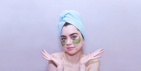 a beautiful girl with patches takes care of her skin.の写真素材