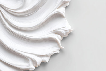 Minimal abstract white cosmetic cream texture with soft sculpted layers and clean copy space for premium skincare branding inspired by japanese anime aestheticsの素材