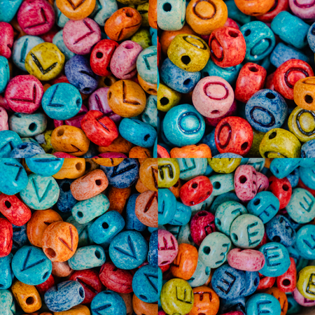 love message with multi colored stones letters. The word love consists of multi-colored stone beads. Symbol of diverse and colorful love.の写真素材