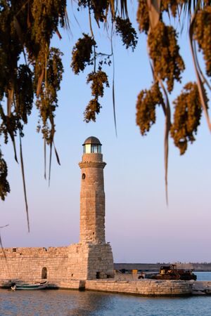 Old lighthouse at port of Rethymno town, Crete island, Greece.の写真素材