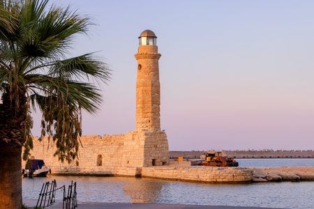 Old lighthouse at port of Rethymno town, Crete island, Greece.の写真素材