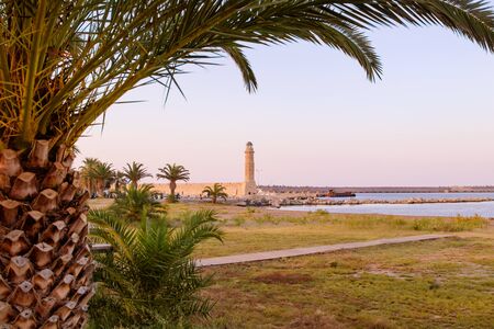 Old lighthouse at port of Rethymno town, Crete island, Greece.の写真素材