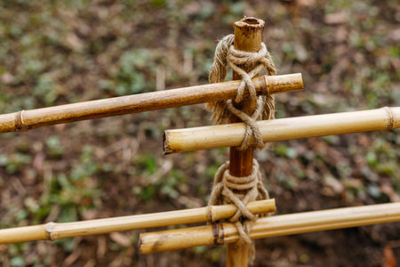 Bamboo fence with rope in the garden. selective focus.の写真素材