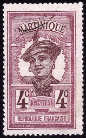 FRANCE - CIRCA 1923: stamp printed in the French colony of Martinique, shows images of woman in traditional head dress, Martinique, series, circa 1923のeditorial素材