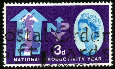 UNITED KINGDOM - CIRCA 1962  A stamp printed in UK shows a portrait of Queen Elizabeth II   NPY Emblem  National Productivity Year , circa 1962のeditorial素材