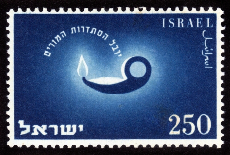 ISRAEL - CIRCA 1955  A stamp printed in the Israel shows image of the old oil lamps, issued in honor of 50th anniversary of the Teacher s Association, circa 1955のeditorial素材