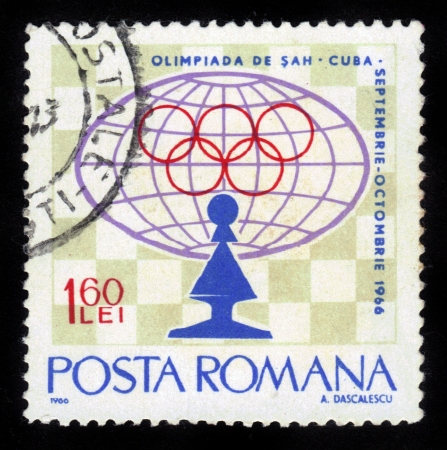 ROMANIA - CIRCA 1966: stamp printed by Romania, shows Pawn and emblem, Chess Olympiad in Cuba in 1966 series, circa 1966のeditorial素材