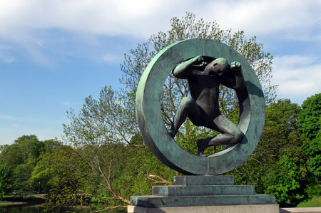 bronze sculpture of a man inside the wheel in Vigeland park, Osloのeditorial素材