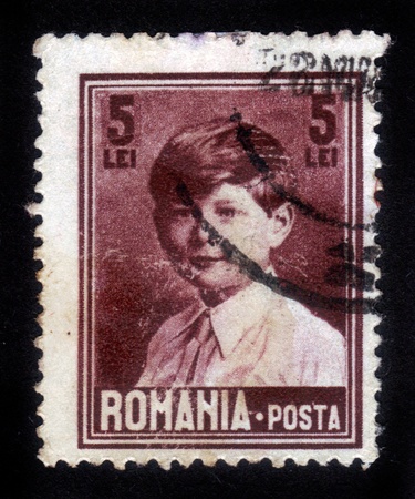 ROMANIA - CIRCA 1928  A stamp printed in Romania shows portrait of King Michael , in childhood , circa 1928のeditorial素材