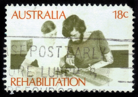AUSTRALIA - CIRCA 1972: a stamp printed in the Australia shows Amputee Assembling Electrical Circuit, Rehabilitation of the Handicapped, circa 1972のeditorial素材
