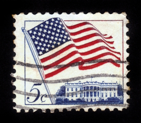 UNITED STATES - CIRCA 1963: stamp printed in United states (USA), shows image of White House and American Flag, series "Flag Issue", circa 1963のeditorial素材