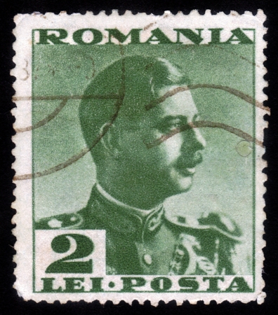 ROMANIA - CIRCA 1935: A stamp printed in the Romania, shows portrait of the King of Romania Carol II on a green background, circa 1935のeditorial素材