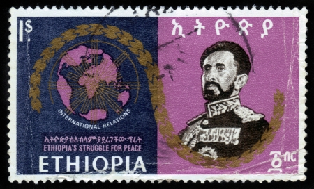 ETHIOPIA - CIRCA 1960 : A stamp printed in Ethiopia shows image of  emperor Haile Selassie on against the background of the world map, is dedicated to international relation of Ethiopia , with the inscription international relation , series, circa 1960のeditorial素材