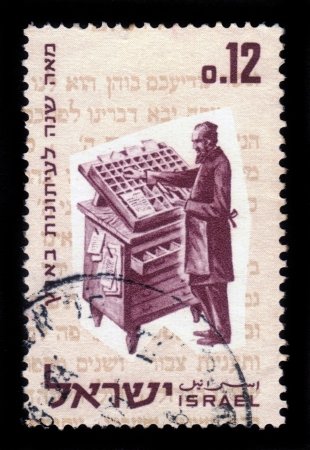 Israel - CIRCA 1963: a stamp printed by Israel shows a jewish type-setter of a century ago, is gaining page newspaper ' Halbanon ' in 1863, circa, 1963のeditorial素材