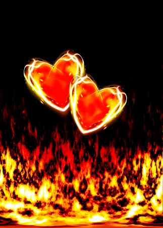 two loving hearts, burning in the flames of love on a black backgroundの写真素材