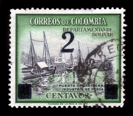 COLOMBIA - CIRCA 1970  A stamp printed in Colombia shows fishing boats in port of Cartagena, circa 1970のeditorial素材