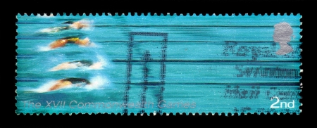 UNITED KINGDOM - CIRCA 2002  A Stamp printed in Great Britain shows swimmers, XVI commonwealth games, circa 2002のeditorial素材