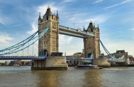 pleasure boat passing under Tower Bridge, London, England のeditorial素材