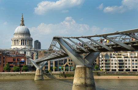 LONDON - July 17  St  Paul s Cathedral and Millennium Bridge, officially known as the London Millennium Footbridge, on July 17, 2013 in London, England opening in June 2000のeditorial素材