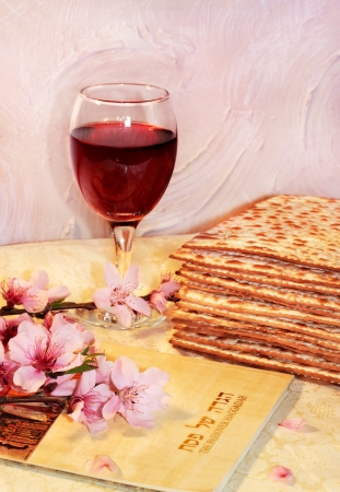 spring holiday of Passover and its attributes, with matzo and Haggadah in Hebrew - Happy Passoverの写真素材