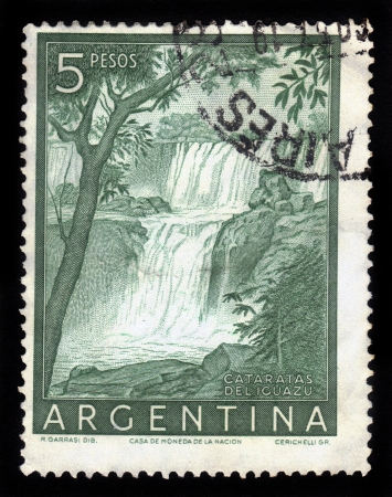 ARGENTINA - CIRCA 1955  a stamp printed in the Argentina shows Iguacu Falls, circa 1955のeditorial素材