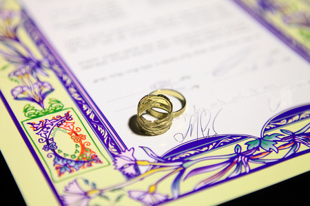 wedding rings and Ketubah - a prenuptial agreement in jewish religious traditionのeditorial素材