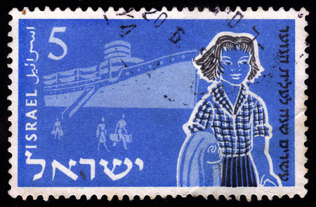 ISRAEL - CIRCA 1955  A stamp printed in Israel, shows young girl against the background of the ship ,  issued in honor of 20th anniversary of Youth Aliyah, Inscription  Twentieth anniversary of Youth Aliyah , series, circa 1955のeditorial素材