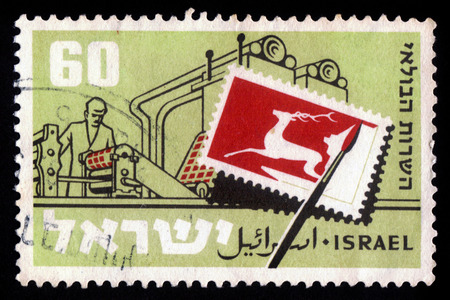 ISRAEL - CIRCA 1959  A stamp printed in Israel, shows designing and printing stamps, circa 1959のeditorial素材