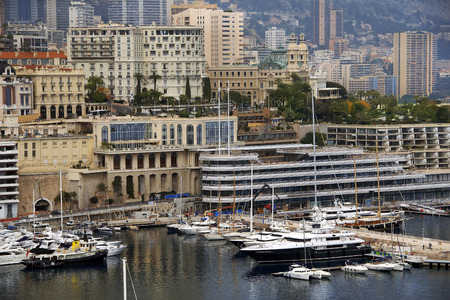 Luxury boats in bay of Monaco and panoramic view over Monte Carlo, French Rivieraのeditorial素材