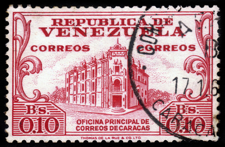 VENEZUELA - CIRCA 1958: a stamp printed in the Venezuela shows General Post Office, Caracas, red, series, circa 1958のeditorial素材