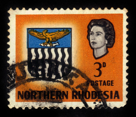 Northern Rhodesia - CIRCA 1963: a stamp printed in Northern Rhodesia, protectorate of the United Kingdom shows coat of arms, circa 1963のeditorial素材