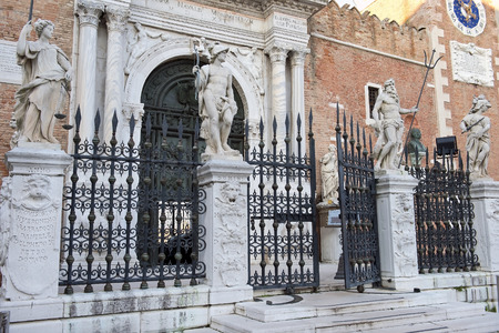 sculptures of ancient gods before main entrance in Venetian Arsenal, Venice, Italyのeditorial素材