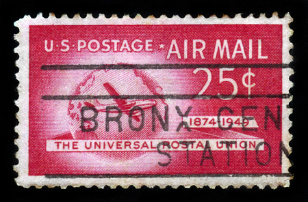 UNITED STATES OF AMERICA - CIRCA 1949: A stamp printed in USA shows Boeing Stratocruiser and Globe, Universal Postal Union Issue, circa 1949のeditorial素材
