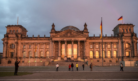 BERLIN GERMANY OCTOBER 13: Tourists walk around the Reichstag building architect Paul Wallot in Berlin Germany on october 13 2014 It was opened in 1894 as a Parliament of the German Empireのeditorial素材