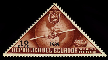 ECUADOR  CIRCA 1939: a stamp printed in Ecuador shows flying plane in the background of the globe and emblem of Ecuador circa 1939のeditorial素材