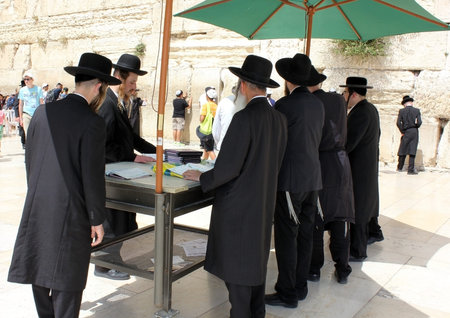 JERUSALEM, ISRAEL - June 03, 2015: orthodox jews pray at the Western Wall in Jerusalem on June 03,...